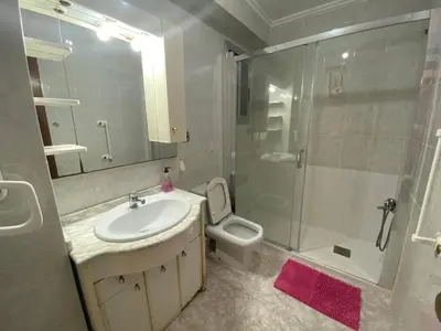 a bathroom with a sink and a shower and a toilet at FLAT FAMILY NEAR BEACH GARDEN CENTER AND METRO in Valencia
