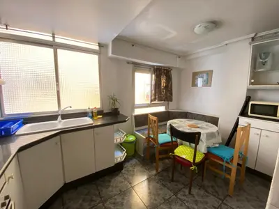 a kitchen with a sink and a table and chairs at FLAT FAMILY NEAR BEACH GARDEN CENTER AND METRO in Valencia