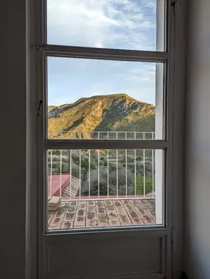 an open window with a view of a mountain at Entre montañas in Dos Aguas