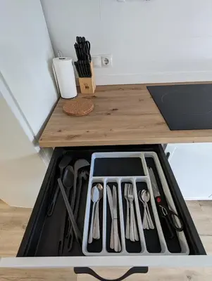 a drawer filled with utensils on a kitchen counter at Entre montañas in Dos Aguas