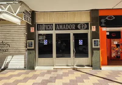 a store front with a person standing in the doorway at Sea view apartment in Cullera