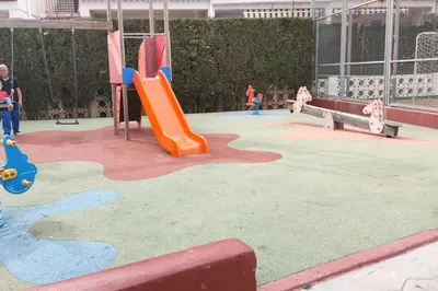 a childrens playground with a slide and a slideintend at Playa Puebla de Farnals Valencia in Masalfasar
