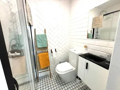 a bathroom with a toilet and a sink and a shower at Loft B El Ramellet in Alginet
