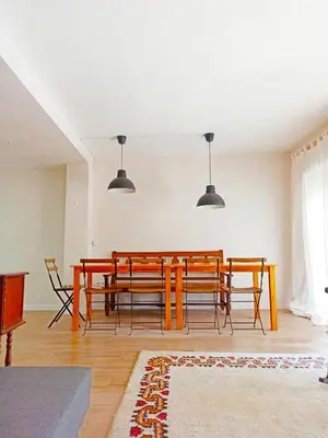a dining room with a table and chairs at Vistas a las palmeras in Burjasot