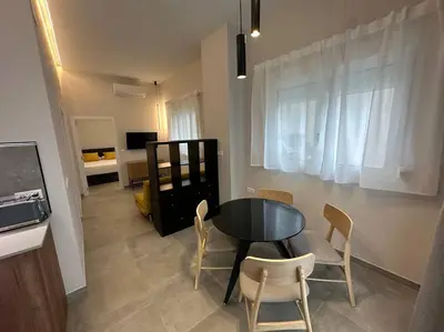 a dining room with a table and chairs in a room at Industrial Style Ruzafa in Valencia