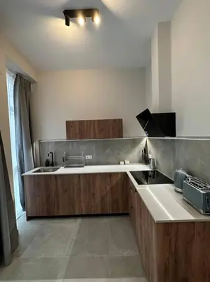 a large kitchen with a tub and a sink at Industrial Style Ruzafa in Valencia