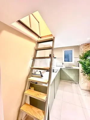 a ladder in a kitchen with a sink at Bali style Ruzafa in Valencia